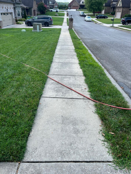 This project involved a comprehensive exterior concrete cleaning of a driveway, front walkway, and sidewalk in Apison using specialized detergents, surface washing equipment, and a thorough rinse to remove mold, mildew, and grime.