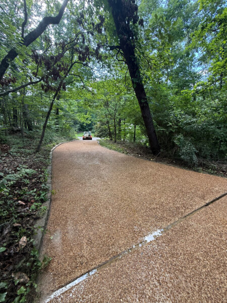 This project involved a comprehensive exterior cleaning of a Chattanooga residence's retaining wall, patio pavers, driveway, and front porch using specialized detergents and pressure washing to remove organic growth and surface debris.
