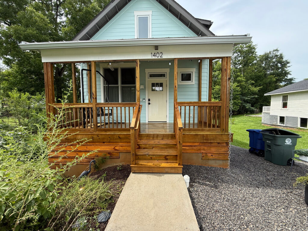Using low-pressure soft washing methods, this project completed a full exterior refresh of a two-story home in Chattanooga, which included cleaning the house siding, front porch and back steps, washing the metal roof, and clearing and flushing the gutter system.