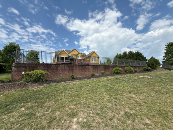 This comprehensive exterior restoration in Soddy-Daisy utilized professional soft-wash and pressure washing techniques to clean the home's siding, concrete surfaces, pool deck, three wood decks, patio furniture, retaining walls, and both interior and exterior windows.