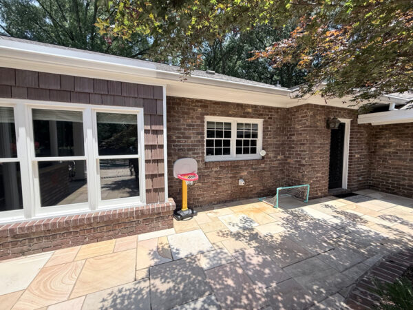This project involved a comprehensive exterior refresh of a Chattanooga home using soft washing and surface cleaning to safely remove dirt, mold, and residue from the siding, gutters, porches, concrete walkways, brick retaining walls, entryway columns, wooden swing, and stone pool deck.