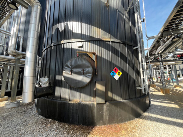 This project involved the complete cleaning and surface preparation of two industrial storage tanks' tops and upper walls using a 40-foot electric lift, pressure washing, and specialized detergents to remove mold, mildew, and dirt.