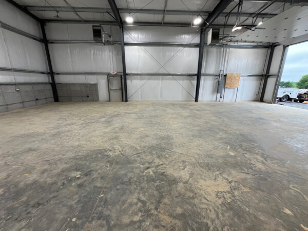 A cleaning of this metal warehouse to remove built-up dirt, grime, and surface staining was done, leaving the slab noticeably cleaner, brighter, and more professional-looking. The wash improved the overall appearance of the space while helping reduce slick residue and making the floor easier to maintain going forward.