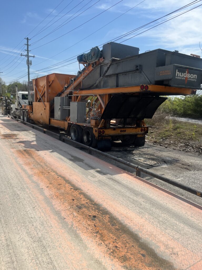 The project involved bi-weekly deluxe exterior cleaning and aluminum brightening of multiple tanker trailers in Chattanooga using a methodical process of pressure washing, specialized chemical application, and manual scrubbing to maintain fleet appearance and protection.