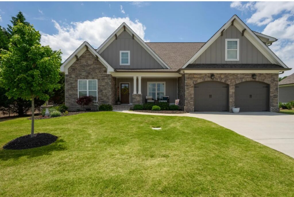This project involved a comprehensive soft-wash and surface cleaning of a two-story home's exterior, driveway, walkways, and pool deck to remove organic growth and debris while protecting the building materials.