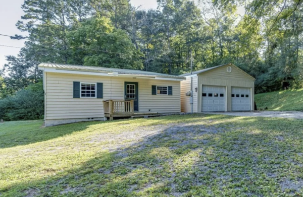 This project involved a comprehensive low-pressure soft wash of a single-story home's exterior surfaces, including siding, trim, and gutters, to remove organic growth and restore a uniform appearance.