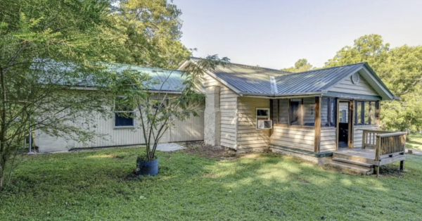 This project involved a comprehensive low-pressure soft wash of a single-story home's exterior surfaces, including siding, trim, and gutters, to remove organic growth and restore a uniform appearance.