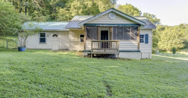 This project involved a comprehensive low-pressure soft wash of a single-story home's exterior surfaces, including siding, trim, and gutters, to remove organic growth and restore a uniform appearance.