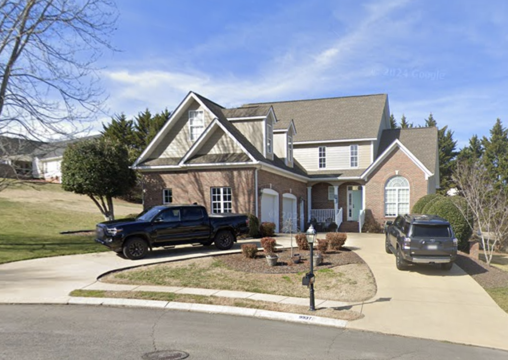 This project involved a comprehensive soft wash and gentle scrubbing of a two-story home's exterior, front steps, retaining wall, and covered back porch in Apison to remove organic buildup and grime, backed by a 1-year mold and mildew warranty.