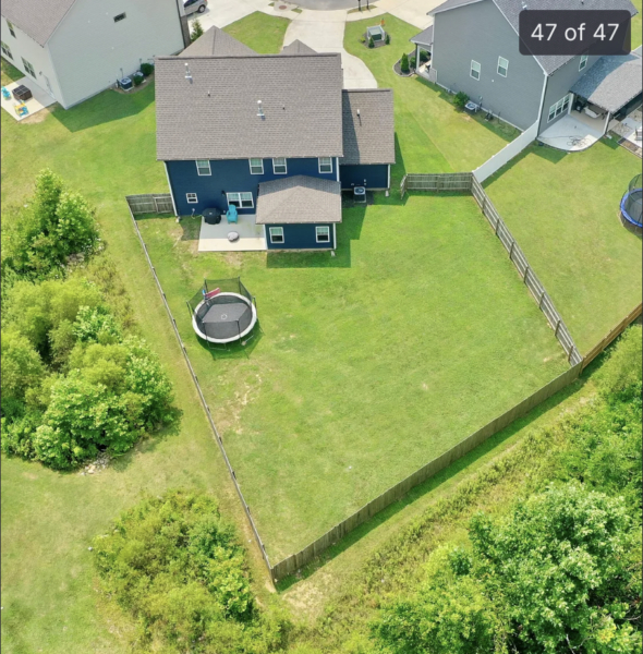 A two-story home in Cleveland, TN, received a comprehensive soft wash cleaning of its vertical surfaces, gutters, and trim, backed by a one-year warranty against mold and mildew regrowth.