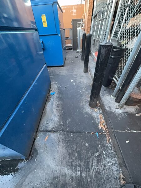 Professional power washing and detergent cleaning were performed on the front stained sidewalk, additional sidewalk sections, the back dock, and the dumpster enclosure to remove all surface debris and buildup.