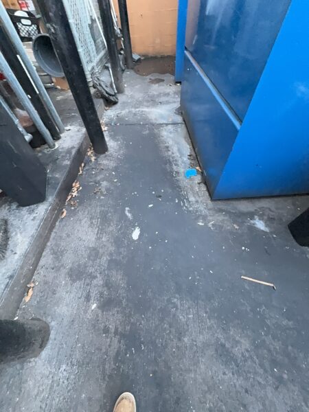Professional power washing and detergent cleaning were performed on the front stained sidewalk, additional sidewalk sections, the back dock, and the dumpster enclosure to remove all surface debris and buildup.