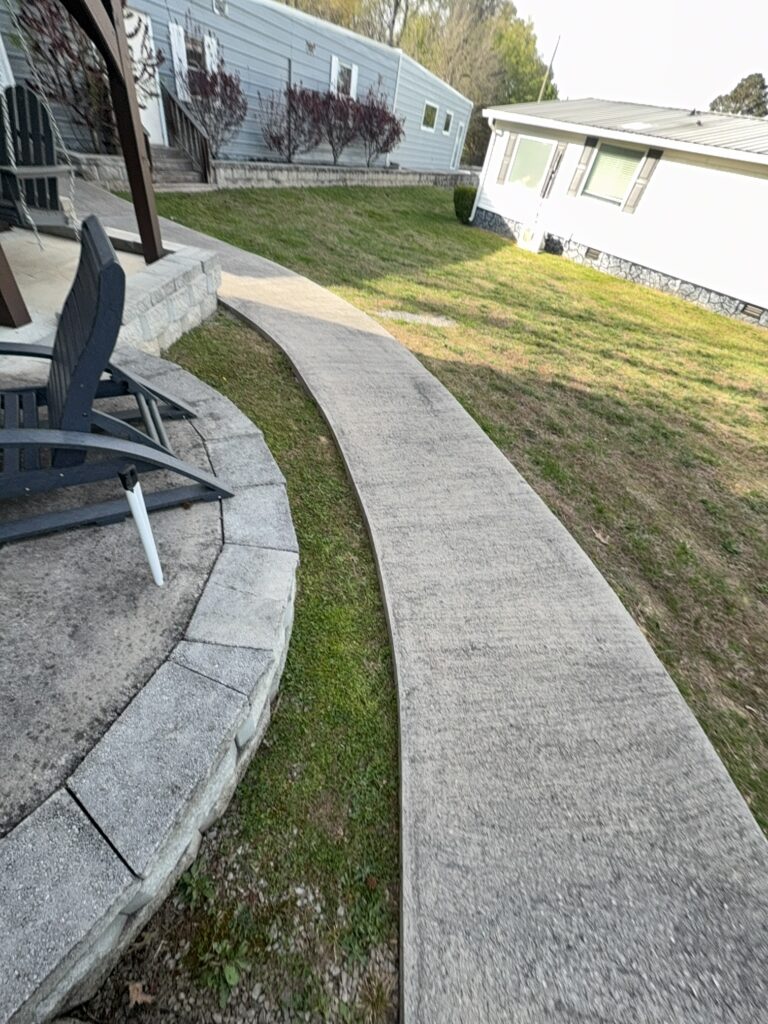 Professional soft wash exterior cleaning will be performed on the main house, porches, and three garage buildings, targeting all vertical surfaces and roofline components to remove organic growth and debris with a one-year warranty.