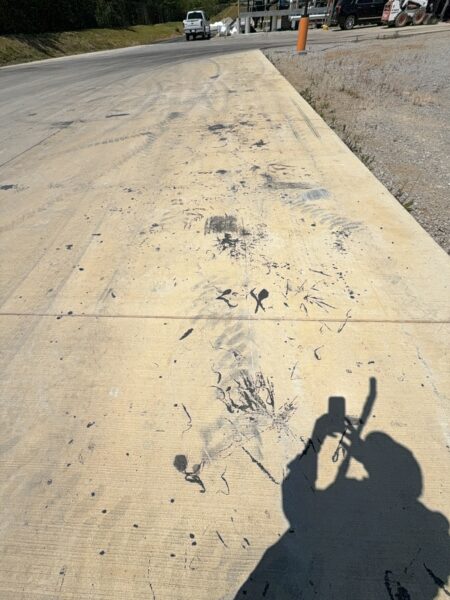 Professional surface washing and detergent treatment were performed on the concrete entrance and exit pads of a commercial scale in Chattanooga to remove organic buildup while strictly adhering to site-specific exclusion zones.