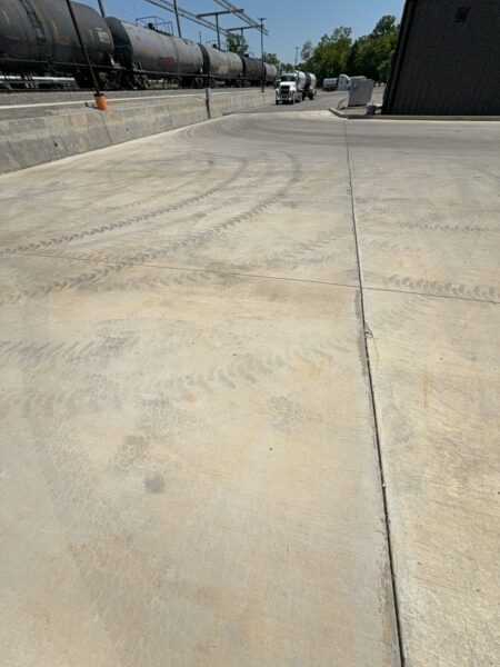 Professional surface washing and detergent treatment were performed on the concrete entrance and exit pads of a commercial scale in Chattanooga to remove organic buildup while strictly adhering to site-specific exclusion zones.
