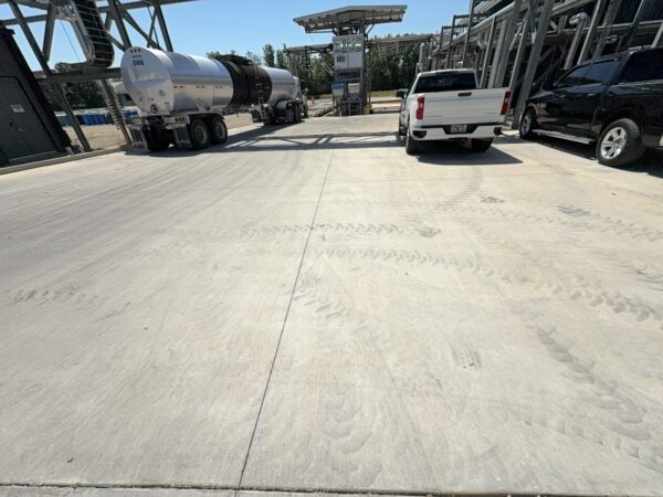 Professional surface washing and detergent treatment were performed on the concrete entrance and exit pads of a commercial scale in Chattanooga to remove organic buildup while strictly adhering to site-specific exclusion zones.