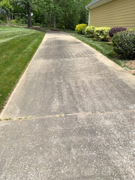 The team performed a targeted soft-wash of the front porches, vertical surfaces, and brick steps of a one-story residence in Chattanooga, complemented by a professional surface cleaning of the driveway, sidewalk, and walkways to enhance curb appeal.