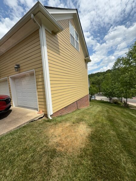 The team performed a targeted soft-wash of the front porches, vertical surfaces, and brick steps of a one-story residence in Chattanooga, complemented by a professional surface cleaning of the driveway, sidewalk, and walkways to enhance curb appeal.