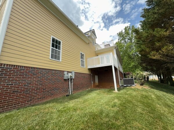 The team performed a targeted soft-wash of the front porches, vertical surfaces, and brick steps of a one-story residence in Chattanooga, complemented by a professional surface cleaning of the driveway, sidewalk, and walkways to enhance curb appeal.