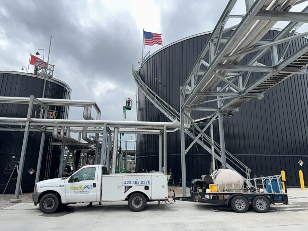 This project involved the complete cleaning and surface preparation of two industrial storage tanks' tops and upper walls using a 40-foot electric lift, pressure washing, and specialized detergents to remove mold, mildew, and dirt.