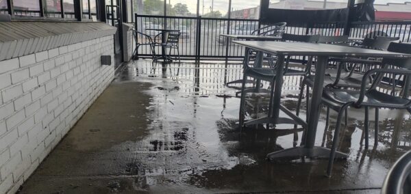 This commercial concrete power washing project in Chattanooga involved clearing the outdoor patio, treating and washing the concrete surface and handrails with specialized detergents to remove organic buildup and grime, and restoring the furniture to its original layout for immediate use.