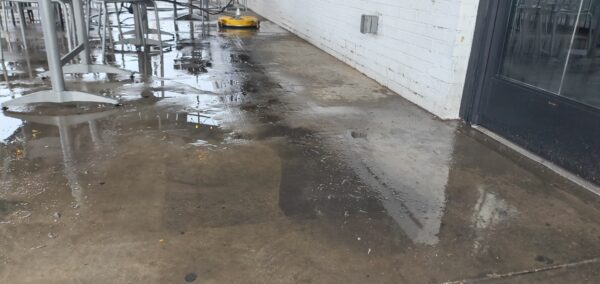 This commercial concrete power washing project in Chattanooga involved clearing the outdoor patio, treating and washing the concrete surface and handrails with specialized detergents to remove organic buildup and grime, and restoring the furniture to its original layout for immediate use.