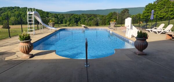This concrete washing project in Chickamauga restored a home's pool deck and connecting walkway by applying a surface-safe detergent and using even-pressure surface washing to remove mold, mildew, and grime.