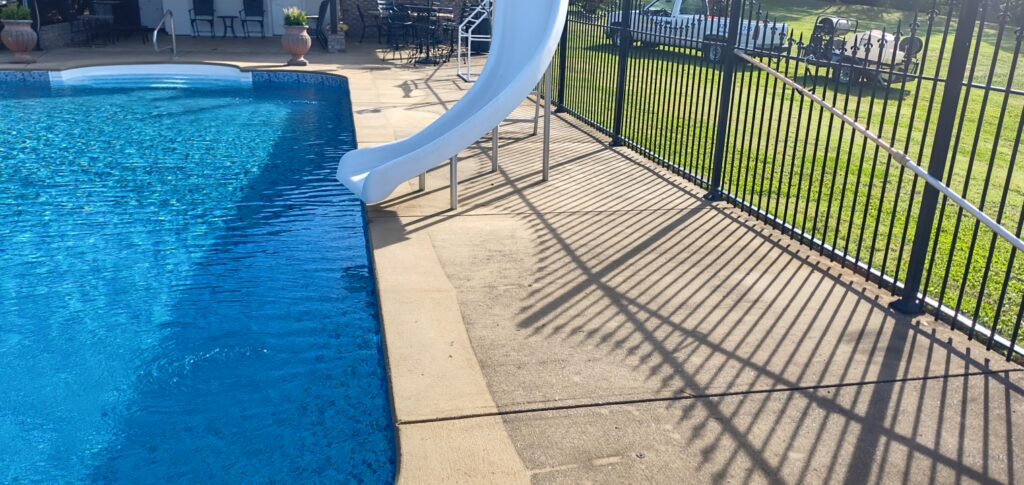 This concrete washing project in Chickamauga restored a home's pool deck and connecting walkway by applying a surface-safe detergent and using even-pressure surface washing to remove mold, mildew, and grime.