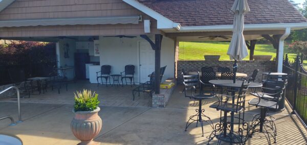 This concrete washing project in Chickamauga restored a home's pool deck and connecting walkway by applying a surface-safe detergent and using even-pressure surface washing to remove mold, mildew, and grime.