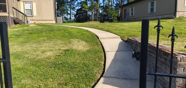 This concrete washing project in Chickamauga restored a home's pool deck and connecting walkway by applying a surface-safe detergent and using even-pressure surface washing to remove mold, mildew, and grime.