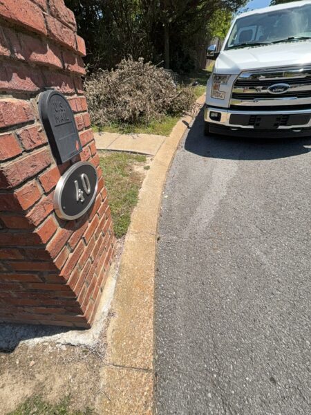 This comprehensive exterior cleaning project involved a full soft wash of the home's surfaces, a dedicated pressure wash of concrete hardscapes and retaining walls, and a gentle cleaning of the wood deck and mailbox to remove organic growth and restore the property's appearance.