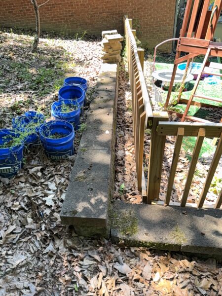 This comprehensive exterior cleaning project involved a full soft wash of the home's surfaces, a dedicated pressure wash of concrete hardscapes and retaining walls, and a gentle cleaning of the wood deck and mailbox to remove organic growth and restore the property's appearance.
