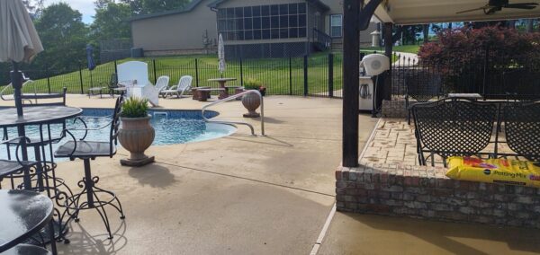 This concrete washing project in Chickamauga restored a home's pool deck and connecting walkway by applying a surface-safe detergent and using even-pressure surface washing to remove mold, mildew, and grime.