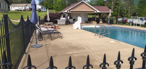 This concrete washing project in Chickamauga restored a home's pool deck and connecting walkway by applying a surface-safe detergent and using even-pressure surface washing to remove mold, mildew, and grime.