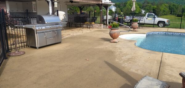 This concrete washing project in Chickamauga restored a home's pool deck and connecting walkway by applying a surface-safe detergent and using even-pressure surface washing to remove mold, mildew, and grime.