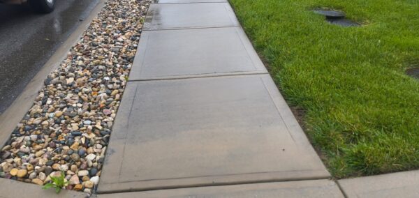 This concrete washing project in Middle Valley revived a driveway, front walkway, and back patio by treating mold and dirt with professional-grade detergents followed by a thorough, methodical power rinse.