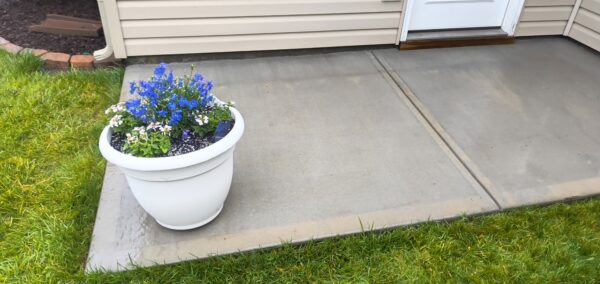 This concrete washing project in Middle Valley revived a driveway, front walkway, and back patio by treating mold and dirt with professional-grade detergents followed by a thorough, methodical power rinse.