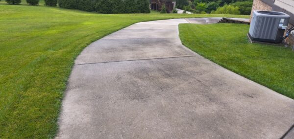 This project in Collegedale involved a comprehensive professional wash and detergent pre-treatment of a concrete driveway and adjacent sidewalk to thoroughly remove heavy dirt, mold, and mildew.