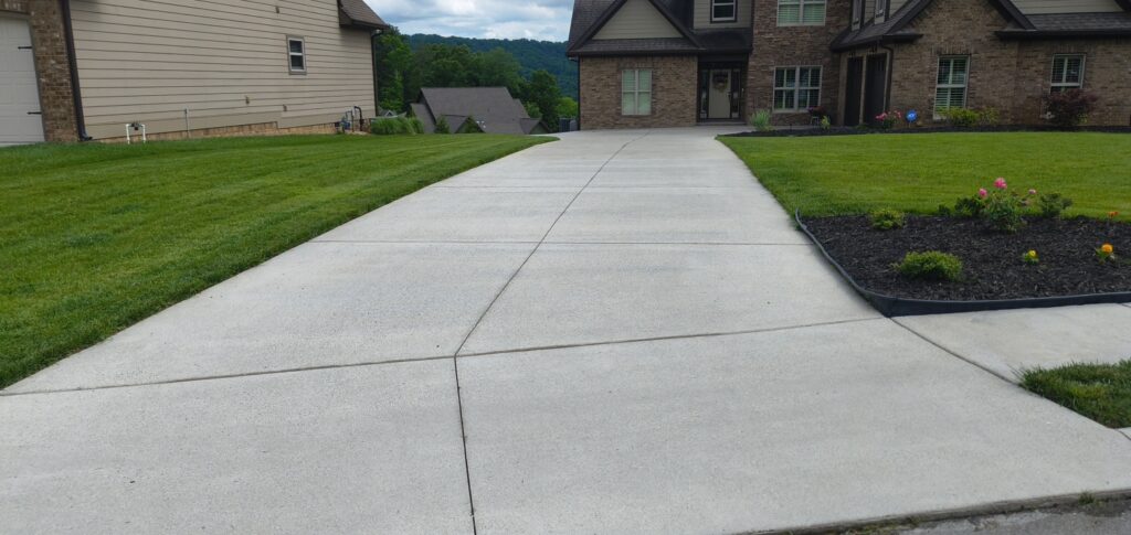 This project in Collegedale involved a comprehensive professional wash and detergent pre-treatment of a concrete driveway and adjacent sidewalk to thoroughly remove heavy dirt, mold, and mildew.