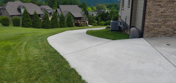 This project in Collegedale involved a comprehensive professional wash and detergent pre-treatment of a concrete driveway and adjacent sidewalk to thoroughly remove heavy dirt, mold, and mildew.