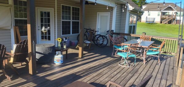 This project utilized low-pressure soft-wash methods to clean the entire two-story exterior envelope, a wood deck with stairs, and first-story exterior windows to remove organic growth and environmental buildup.