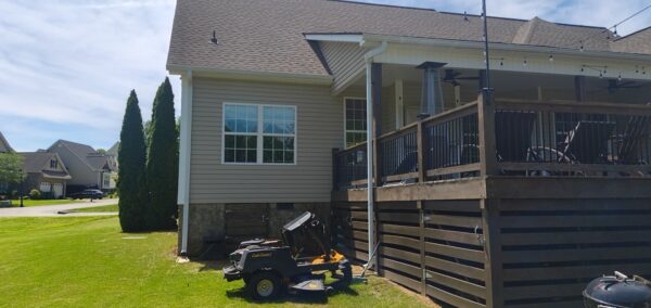 This project utilized low-pressure soft-wash methods to clean the entire two-story exterior envelope, a wood deck with stairs, and first-story exterior windows to remove organic growth and environmental buildup.