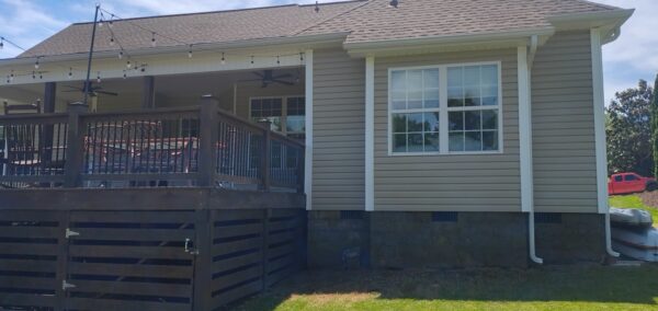 This project utilized low-pressure soft-wash methods to clean the entire two-story exterior envelope, a wood deck with stairs, and first-story exterior windows to remove organic growth and environmental buildup.