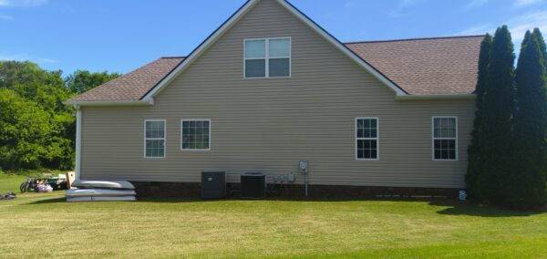 This project utilized low-pressure soft-wash methods to clean the entire two-story exterior envelope, a wood deck with stairs, and first-story exterior windows to remove organic growth and environmental buildup.
