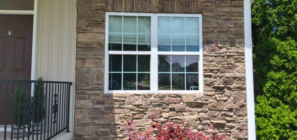 This project utilized low-pressure soft-wash methods to clean the entire two-story exterior envelope, a wood deck with stairs, and first-story exterior windows to remove organic growth and environmental buildup.