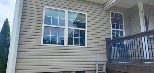 This project utilized low-pressure soft-wash methods to clean the entire two-story exterior envelope, a wood deck with stairs, and first-story exterior windows to remove organic growth and environmental buildup.