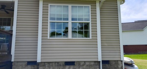 This project utilized low-pressure soft-wash methods to clean the entire two-story exterior envelope, a wood deck with stairs, and first-story exterior windows to remove organic growth and environmental buildup.