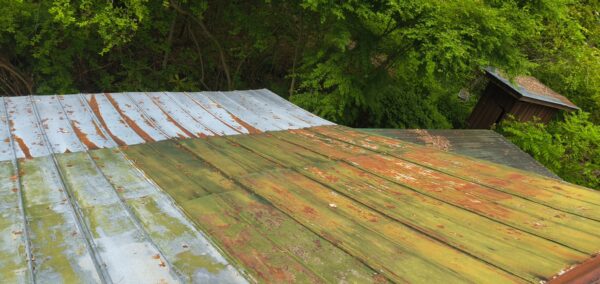 This project involved the soft washing of a one-story residence's exterior, its driveway and walkway pavers, and a stone fountain, alongside the cleaning of a commercial metal roof, to remove organic growth and restore the appearance of all surfaces in McDonald.