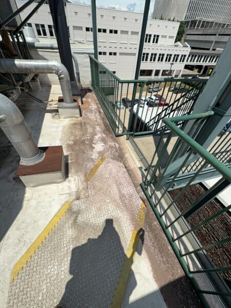 This project involved a comprehensive exterior soft wash and concrete power washing of a commercial property in Chattanooga, utilizing a 60-foot manlift to safely and thoroughly clean the building's masonry, sidewalks, stairs, and roof.