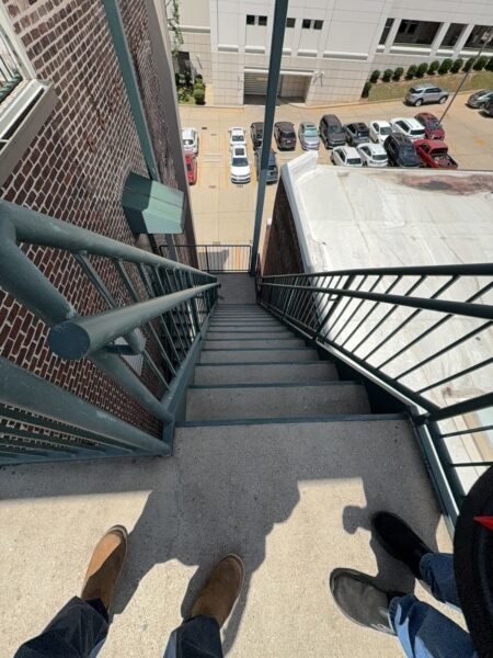 This project involved a comprehensive exterior soft wash and concrete power washing of a commercial property in Chattanooga, utilizing a 60-foot manlift to safely and thoroughly clean the building's masonry, sidewalks, stairs, and roof.
